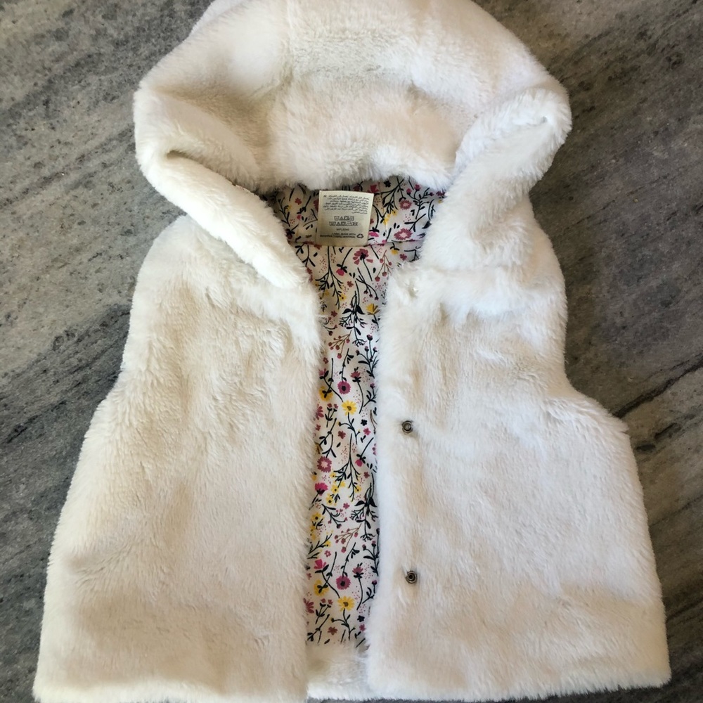 Faux fur hooded vest with floral lining